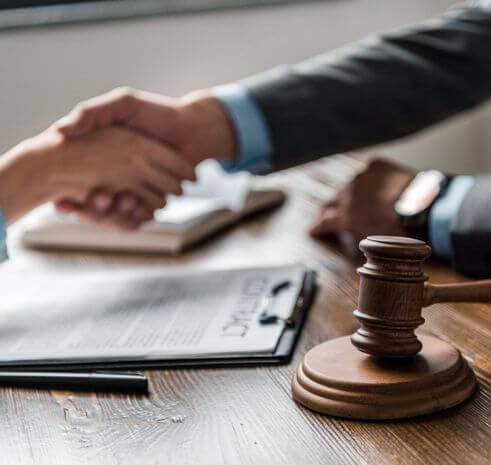 lawyer shaking hands with client