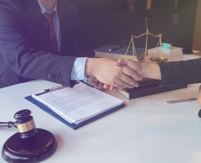 lawyer shaking hands with client